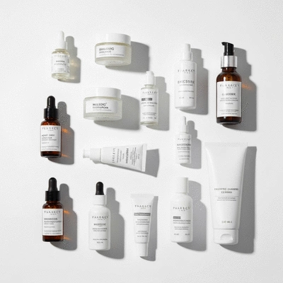 Clean product photography of various skincare products like serums, moisturizers, and cleansers